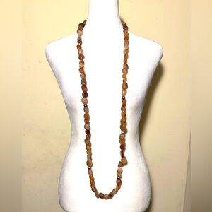 Amber-colored stone necklace, approximately 49” long
